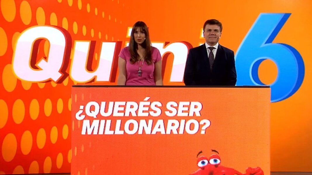 Boleto del Quini 6 y dinero en efectivo sobre una mesa